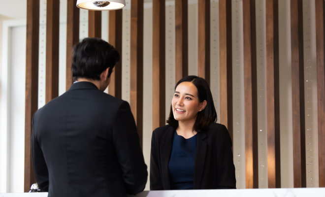 Hotel guest support at reception desk