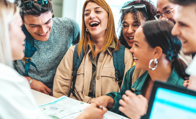 Happy hotel guests at registration desk
